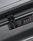 Charcoal grey hard-shell suitcase with combination lock and zip closure