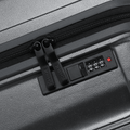 Charcoal grey hard-shell suitcase with combination lock and zip closure