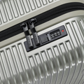 Silver small cabin suitcase with black zipper and combination lock panel