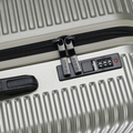 Silver suitcase zipper track with built-in combination lock panel
