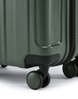 Small cabin suitcase with dark green wheels and corner bumper detail