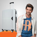Light blue rolling suitcase with four wheels and side zipper detail, next to a man.