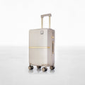 Hard-shell polycarbonate trolley luggage, beige, front view with telescoping handle and wheels
