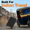 Black hard-shell rolling suitcase with telescopic handle and four wheels, front-left view