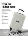 Light grey cabin trolley suitcase at an angle with four wheels for real-world testing
