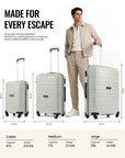 Set of light grey cabin trolley suitcases on wheels with telescopic handles