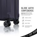 Dark navy 360° spinner wheels on a cabin trolley with quiet glide feet