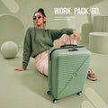 Polypropylene cabin spinner suitcase in green with telescopic handle and four corner wheels