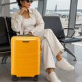Yellow cabin trolley suitcase with telescopic handle and spinner wheels, front view
