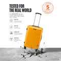 Polypropylene trolley in yellow with wheels, standing upright on cracked ground