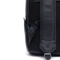 Black leather backpack side view with adjustable strap and front pocket flap