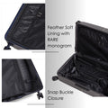 Hard-shell trolley suitcase interior detail with zipped pockets and snap-buckle closure