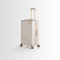 Beige hard-shell trolley with telescopic handle, front zipper, and four spinner wheels