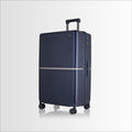 Dark blue hard-shell trolley suitcase front view with side carry handle and spinner wheels