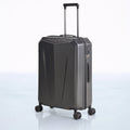 Hard shell polycarbonate trolley luggage in dark grey with side panel and telescopic handle