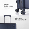 Hard-shell wheeled luggage with two front wheels and telescopic handle, dark color.