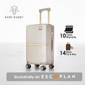 Beige hard-shell polycarbonate trolley suitcase, side profile with telescopic handle and wheels