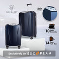 Matte hard-shell trolley suitcase, dark blue with telescoping handle and four wheels