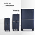 Hard-shell wheeled suitcases in three sizes, dark shells with wheels and handle.