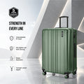 Dark green hard-shell rolling suitcase with ribbed shell, tamper-proof zipper, 4 spinner wheels