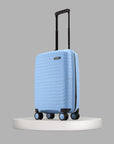 Light blue hard-shell suitcase with telescopic handle and four wheels.