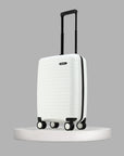 White small cabin suitcase standing upright with four caster wheels and black frame
