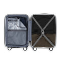 Small white suitcase opened to show gray interior lining and cross strap