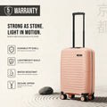 Peach polypropylene cabin suitcase standing on 4 small wheels