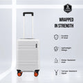 White cabin suitcase with telescopic handle and 4 double spinner wheels, orange details