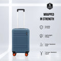 Blue cabin hard-shell suitcase with 8 wheels and white telescopic handle, upright.