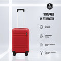 Red small cabin suitcase with telescopic handle, side zipper, and 8 spinner wheels.