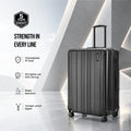 Dark hard-shell upright suitcase with side handle, vertical grooves, and spinner wheels