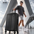 Black polycarbonate check-in suitcase with ridged shell, top handle, and 8 wheels