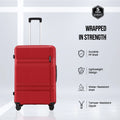 Medium red hard-shell suitcase with upright handle, 8 wheels, and side grip panel