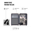 Medium hard-shell suitcase open interior with shoe bag pocket and compression straps