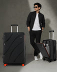 Black hard-shell trolley suitcase with red wheels and side handle, upright view
