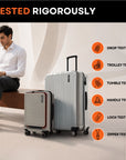 Silver upright trolley suitcase with front panel and spinner wheels on test display