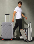 Medium grey hard-shell spinner suitcase with side handle and red wheel accents