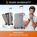 Medium grey hard-shell spinner suitcase with open laptop compartment and red wheels
