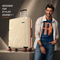 Beige large suitcase beside a person, featuring textured shell and 8 wheels