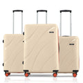 Three beige hard-shell trolley suitcases stacked with handles and four wheels.