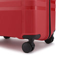 Red hard-shell suitcase with low-profile wheel and side handle