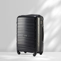 Black polypropylene check-in trolley with 4 wheels and side handle, ridged shell