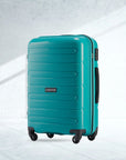 Teal polypropylene check-in trolley with 4 wheels and side handle, ridged shell