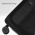 Hard-shell trolley suitcase interior with feather-soft lining and smooth-rolling wheel.