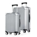 Two silver upright hard-shell suitcases with four wheels and side grips