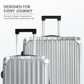 Polycarbonate suitcases with telescopic handles, overlapping front views