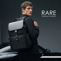Black Gallardo-style backpack on a model, featuring a contoured front pocket and straps.