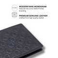 Black bi-fold leather wallet with embossed R monogram on the front panel.