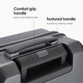 Hard-shell polycarbonate trolley luggage top handle with textured grip and molded handhold
